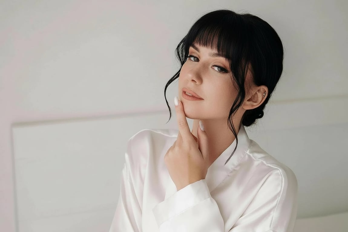 a portrait of a person edited to move the hairline forward in a clear and aggressive way, filling sparse frontal areas so the hair starts lower on the forehead and creates a thicker, more youthful hair frame