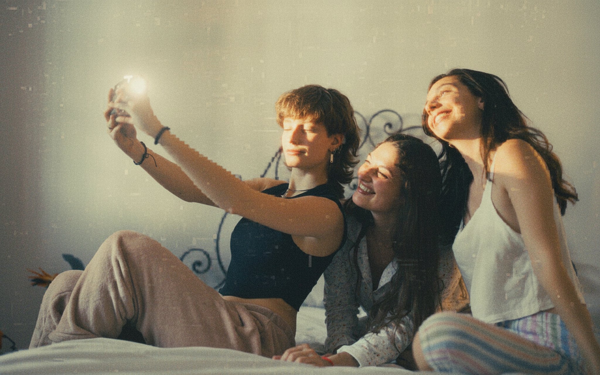 Group photo with a vintage digital camera filter and harsh flash, mimicking the MySpace era aesthetic.