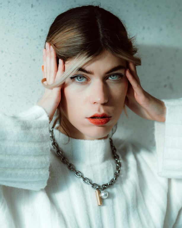 AI big eyes filter before photo - women wearing white sweater
