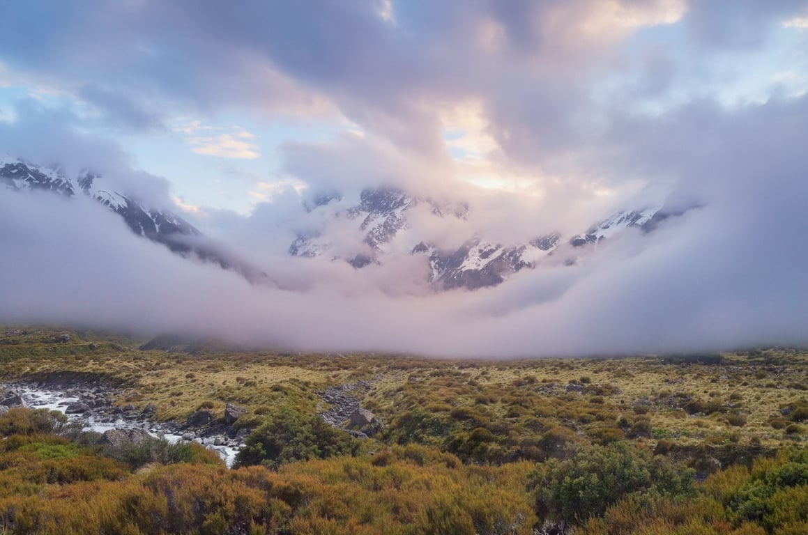 A serene landscape where a mountain range blends smoothly into a cloud formation, creating a dreamlike, continuous scene with soft color transitions.