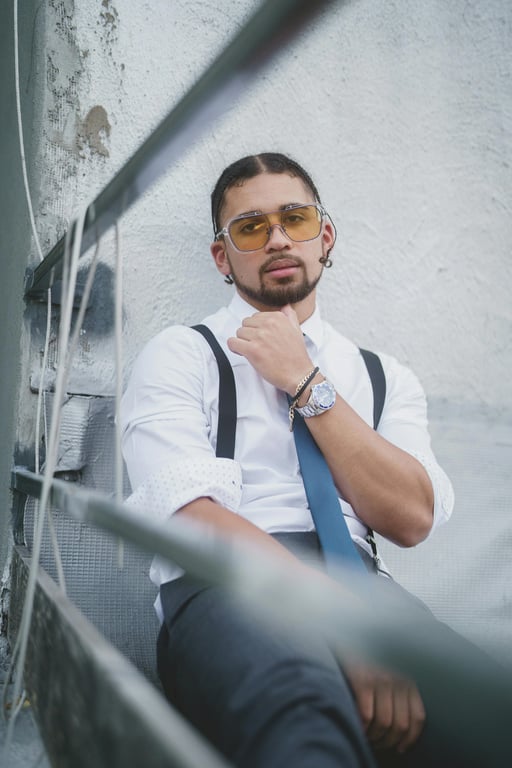 a portrait of a person photographed at eye level in a head-and-shoulders crop; increase hair volume only by enhancing strand density and fullness at the crown and mid-length areas; lift roots slightly to create visible thickness; preserve original hairline shape, hairstyle, and hair length; do not modify face, pose, background, or clothing; avoid inflated, helmet-like hair shapes; maintain realistic strand separation, flyaways, and natural hair flow; lighting unchanged; result should look like naturally fuller hair, not restyled hair