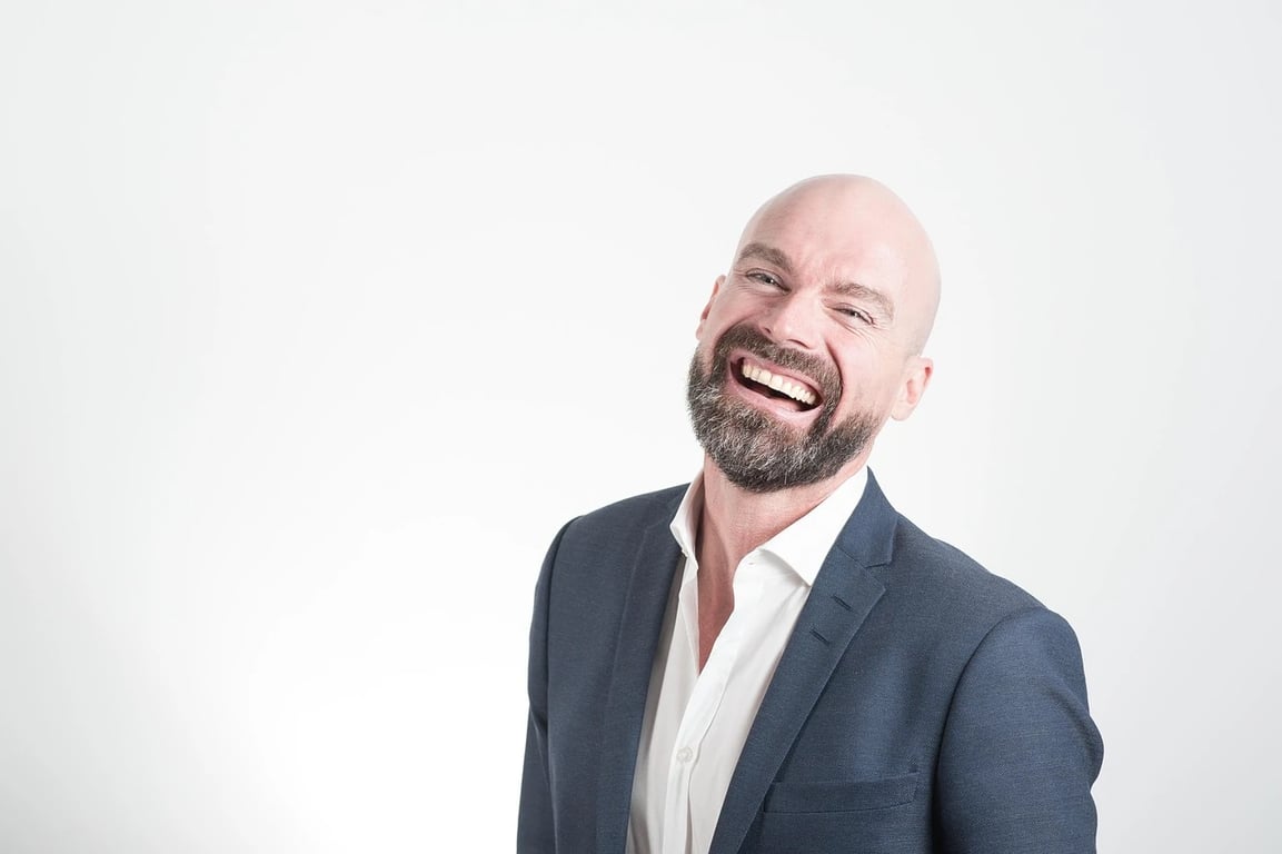 AI teeth whitening filter before photo - smiling businessman in suit with white background