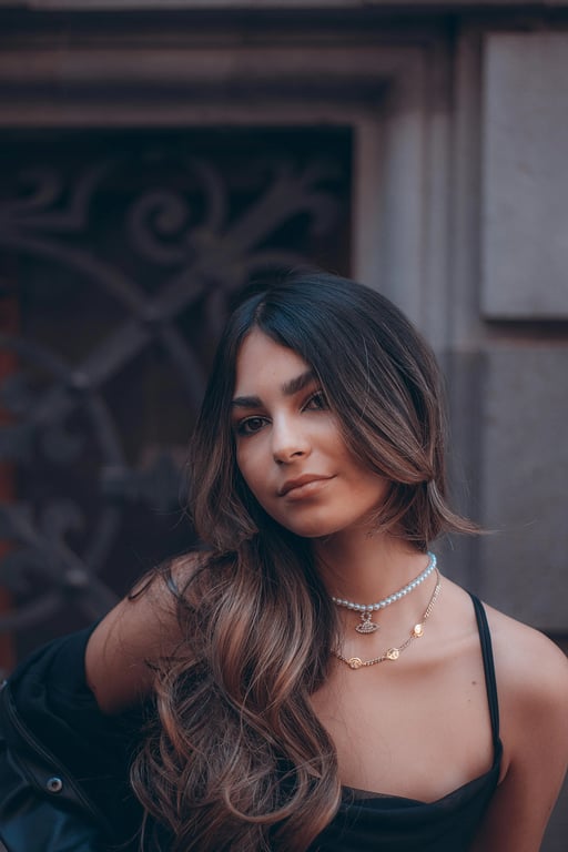 a fishtail braid with intricate sections, loosely woven for volume and texture, with natural-looking separation between the strands, and a polished finish that enhances the overall texture