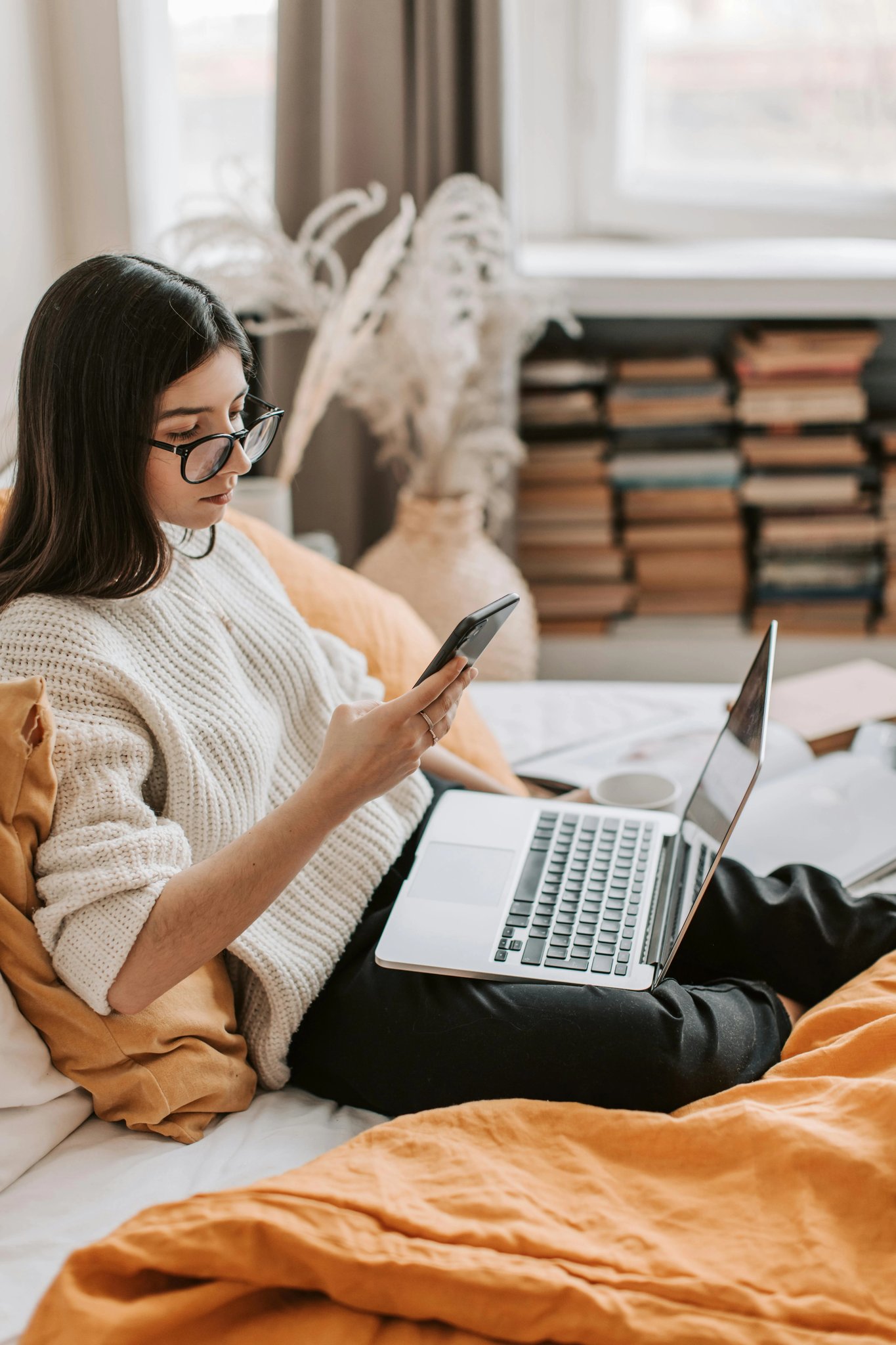 A photo of a person looking at a screen, tablet, or gesturing in empty space.