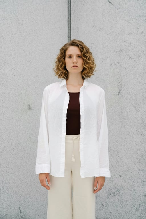 AI Curly hair filter after pic - woman portrait with curly hair in white suit