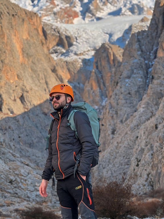 create a dating-ready profile photo by correcting camera angle to eye level, improving posture to appear open and confident, redesigning lighting to remove harsh facial shadows, enhancing eye visibility, sharpening facial detail while preserving skin texture, simplifying the background, and ensuring the result looks clearly more flattering and intentional than the original casual photo