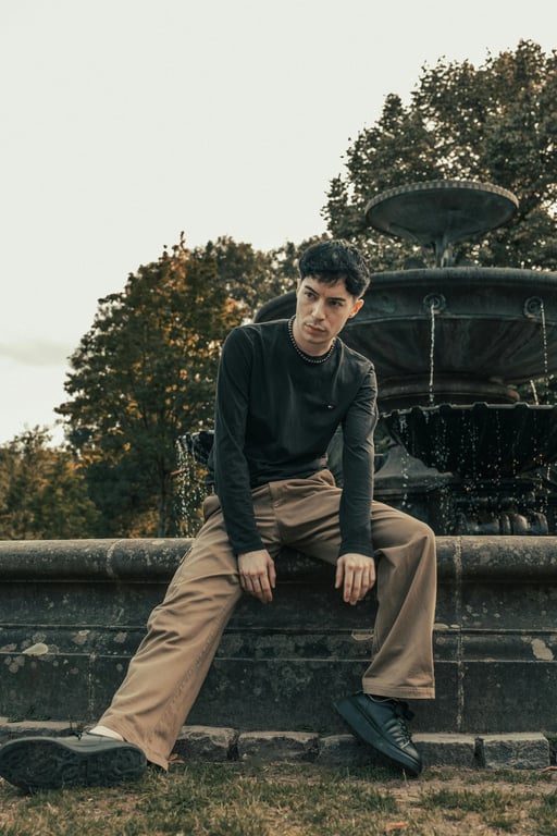 a portrait of a person stylized in a pop art filter aesthetic featuring vivid colors, bold outlines, graphic simplicity, and mass-culture visual language