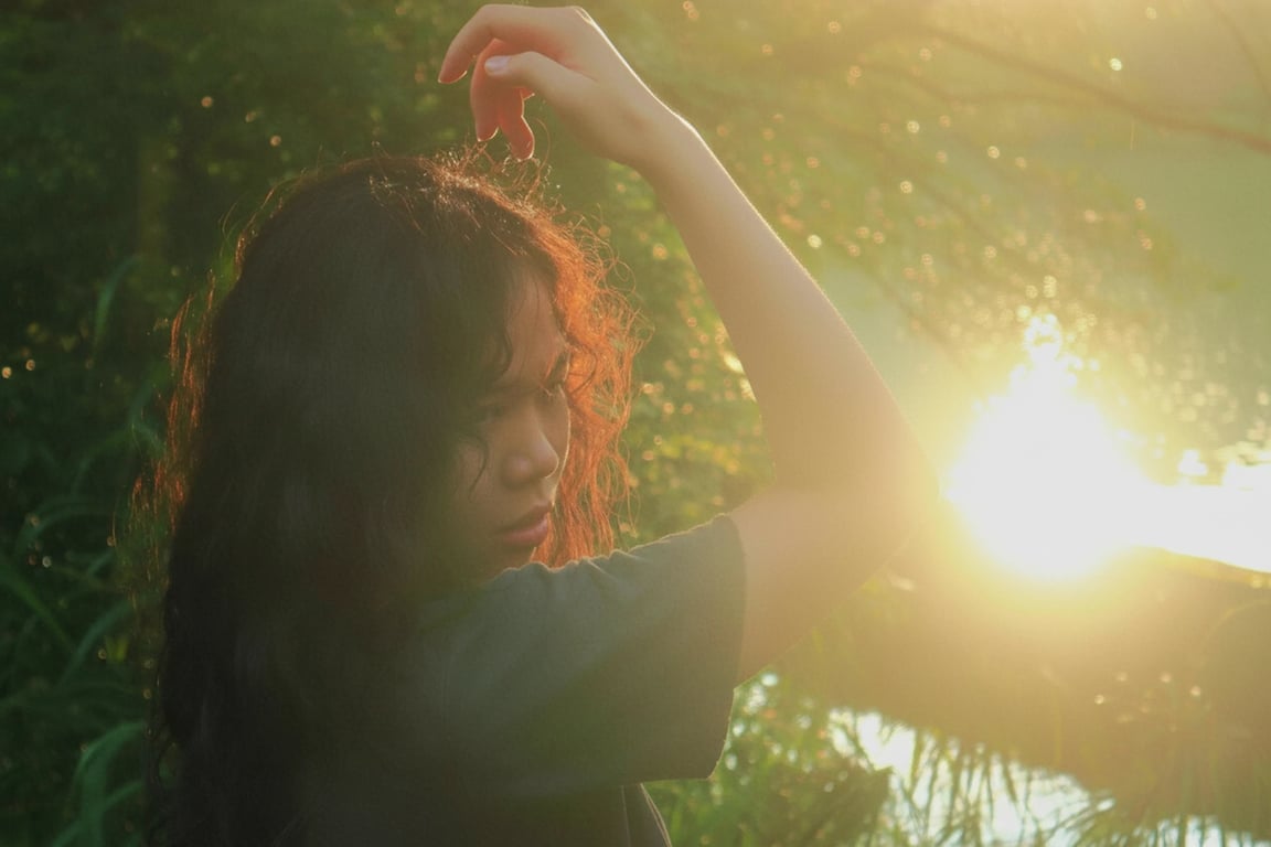 a portrait of a person with clean light balance restored by removing disordered flare and shadow artifacts, maintaining natural key light and fill light on the face, and improving overall clarity without flattening features