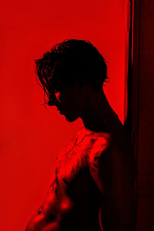 AI remove color from image before photo - person silhouette with vivid red background
