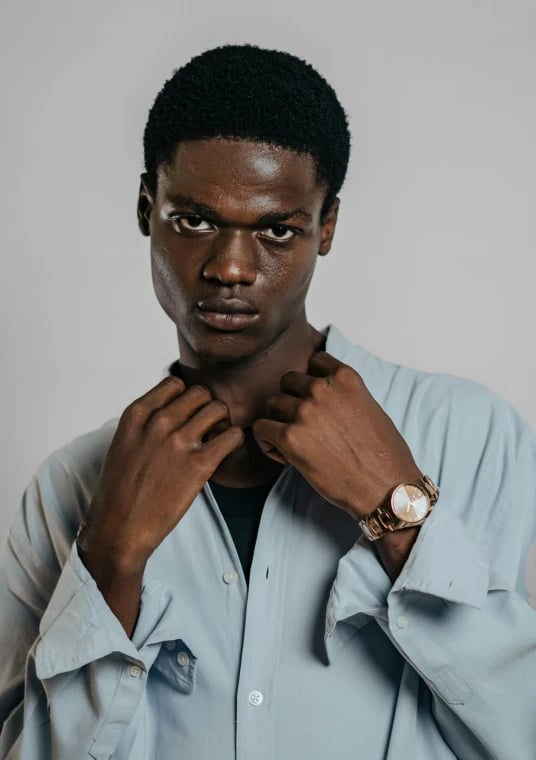 a portrait of a person reimagined in a Japanese anime battle art style with strong line contrast, expressive posture, and traditional anime outfit structure