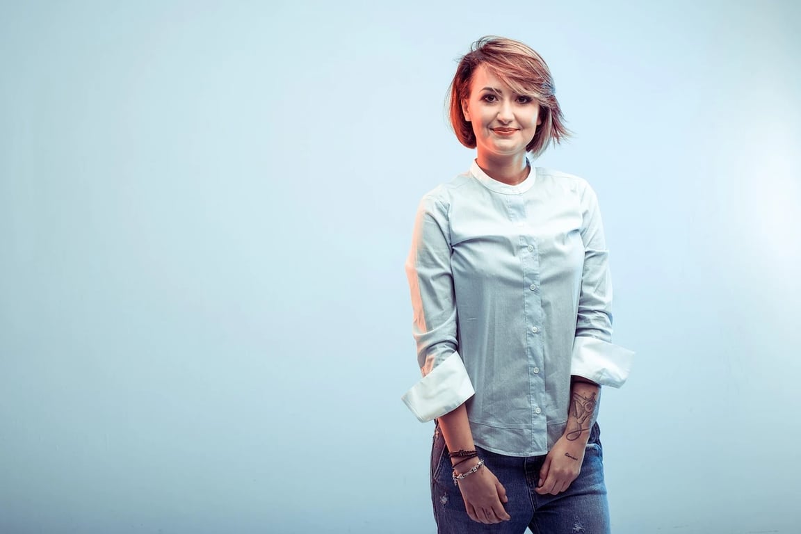 AI green screen remover before photo - woman standing on green backdrop