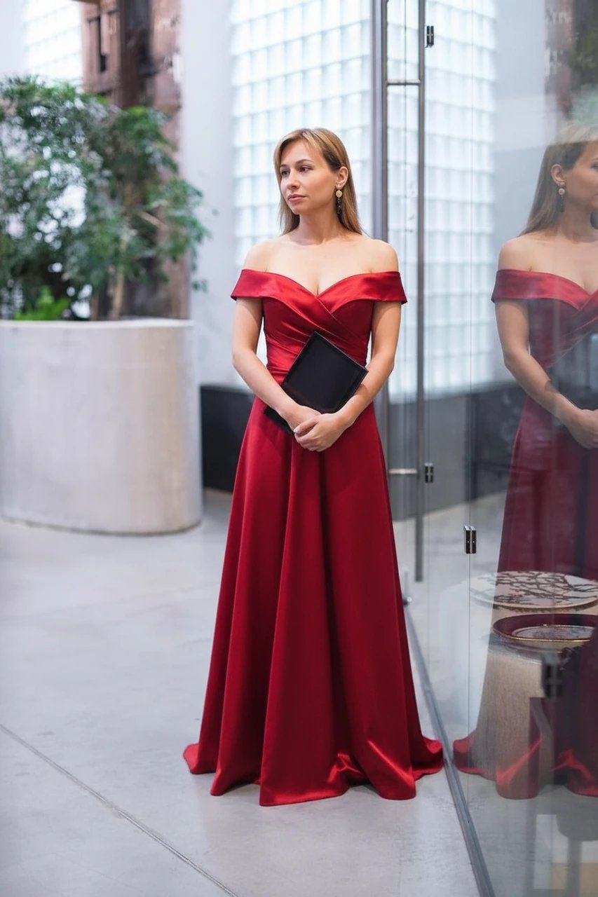 AI virtual try-on showing a red satin prom dress with an off-shoulder neckline and elegant drape.
