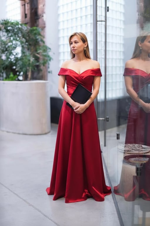 AI virtual try-on showing a red satin prom dress with an off-shoulder neckline and elegant drape.