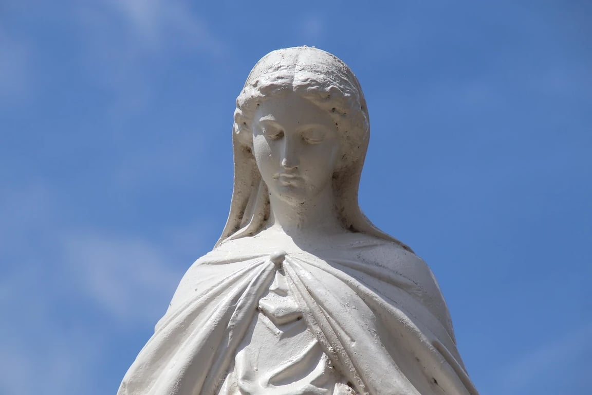 AI remove color from image before photo - white statue with blue sky background
