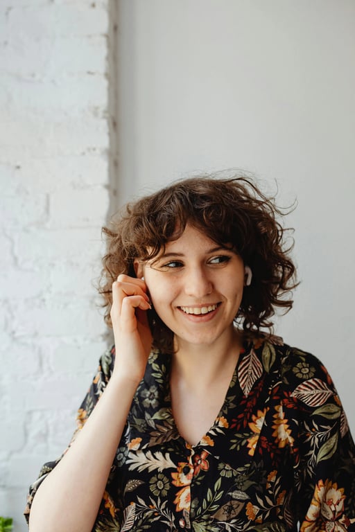 a portrait of a person dressed in a minimalist long-sleeve dress with precise cut, subtle seam lines, fluid fabric movement, calm posture, soft neutral illumination