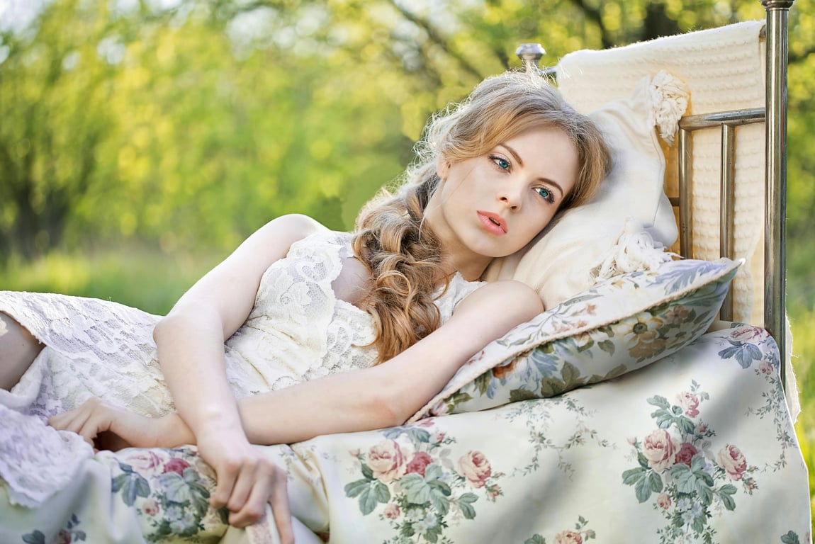 ai-vampire-filter before pic - woman lying in grass under sunlight