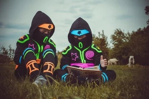 Kids ninja after – child in a glow ninja suit with luminous lines
