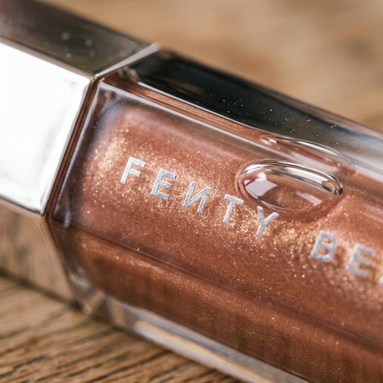 Create a close-up shot emphasizing the lipstick’s sheen, material details, and fine texture, highlighting surface quality and realistic reflections while maintaining the precise product design and original look.