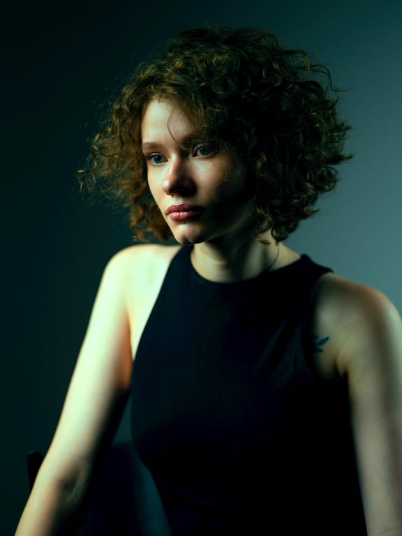 a portrait of a person transformed into a professional corporate headshot with natural expression, upright stance, soft directional lighting, refined facial structure, neutral background tones, and realistic photography-style detail