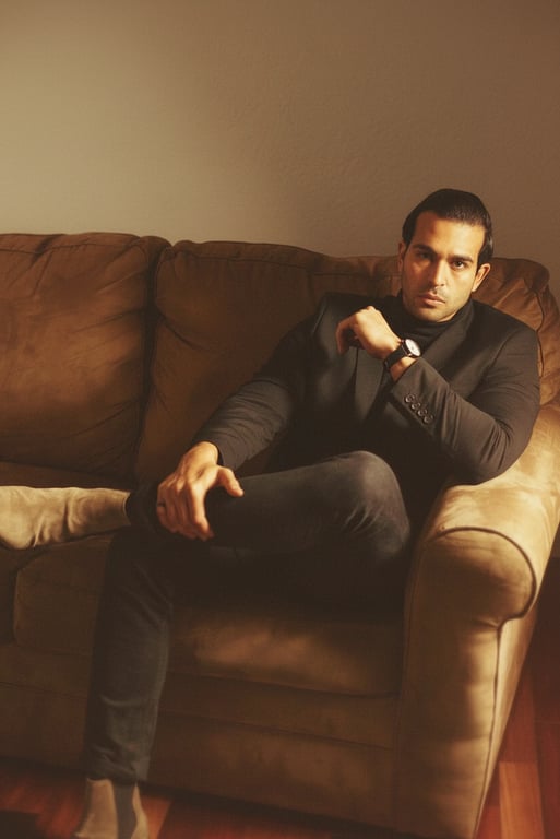 An Instagram photo of a man with soft light filter, reduced texture clarity, blended color transitions, soft focus around edges, warm and inviting mood, indoor setting.