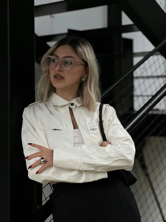 An urban street scene where a bright sun is added to create strong, dramatic shadows from buildings and people, increasing contrast and depth.