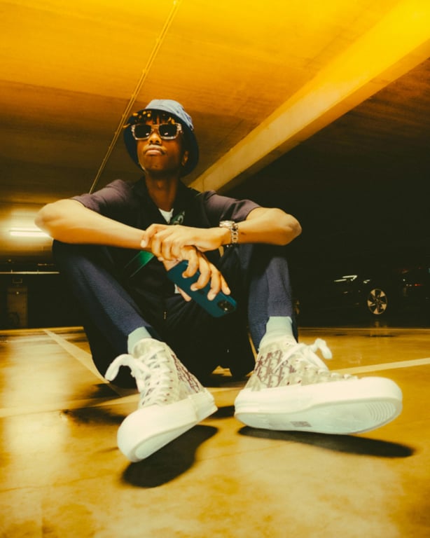 ai action figure generator before: a man sitting on the ground