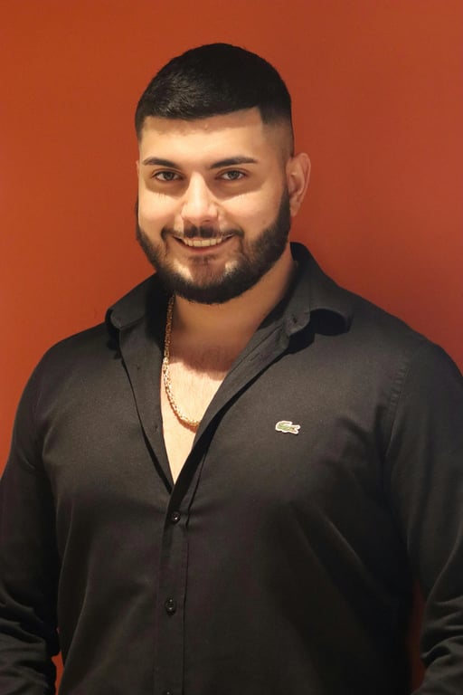 a portrait of a person edited to create a noticeably smaller face appearance by strongly compressing facial width from both sides, reducing cheek and jaw size, making the face appear slimmer and more compact relative to the head and body, with an obvious slimming result