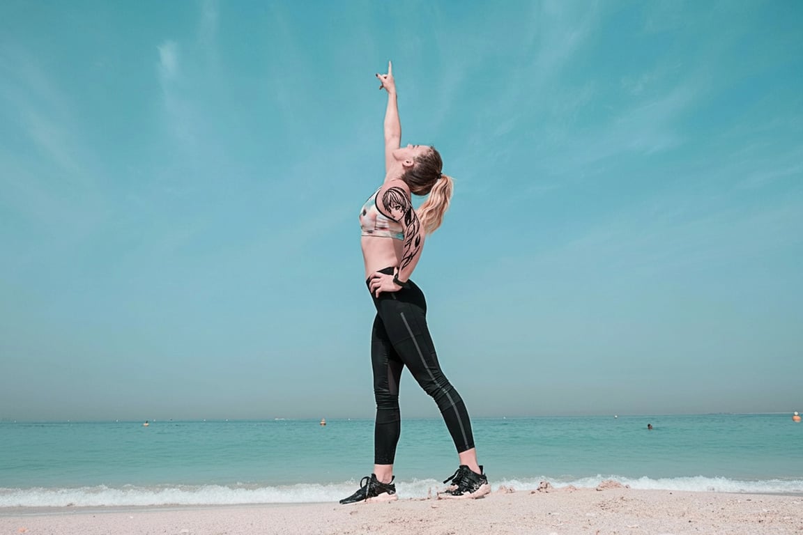 anime tattoo after photo - woman doing the yoga on the beach with anime tattoo