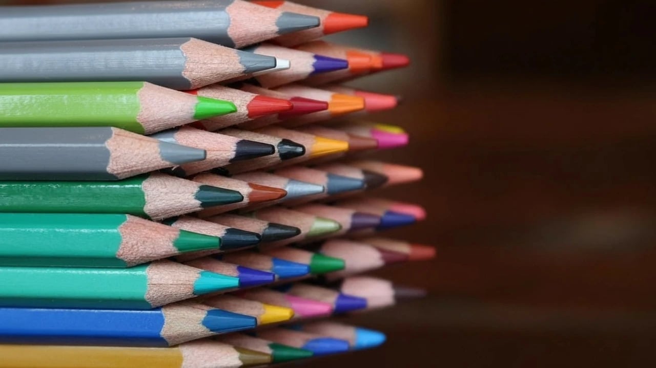 AI remove color from image before photo - stack of colorful pencils arranged neatly