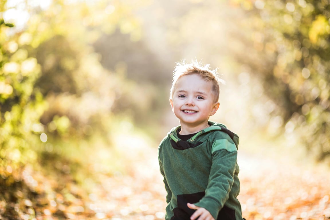 AI baby Christmas photo before photo - baby wearing green jacket