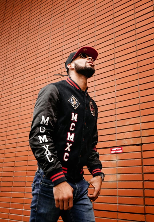 a portrait of a person transformed into a Marvel Rivals–style game character with stylized realistic facial proportions, clean skin rendering, bold heroic lighting, and modern superhero game visuals