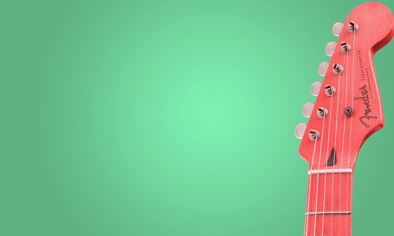 AI green screen remover before photo - red guitar placed on green background