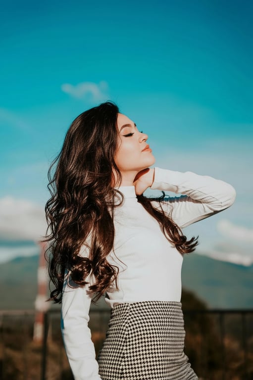 a portrait of a person edited to boost hair volume only, enhancing thickness through strand-level density rather than reshaping; maintain original hairstyle direction and length; keep hairline natural; avoid artificial shine or blur; do not modify facial identity, body posture, or background; output should look like a realistic volume enhancement