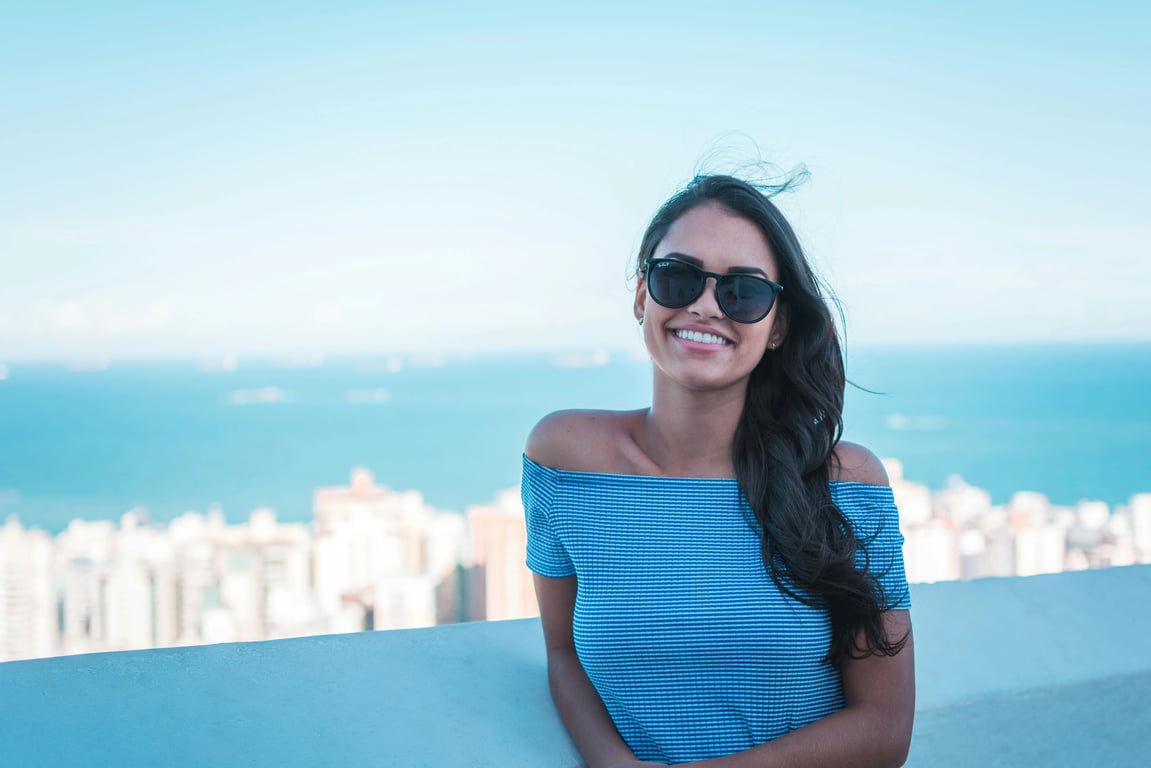 a portrait of a person styled with cinematic golden hour visuals, showing subtle lens glow, rim light along hair and shoulders, warm midtones, and smooth tonal transitions