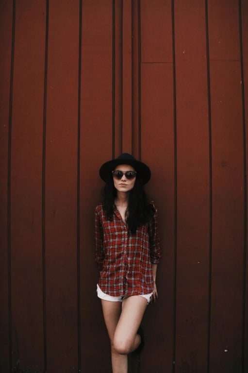 a portrait of a person edited to reshape the midsection into an extremely narrow waist while hips remain wide and stable, creating a dramatic and unmistakable waistline with a strong visual impact