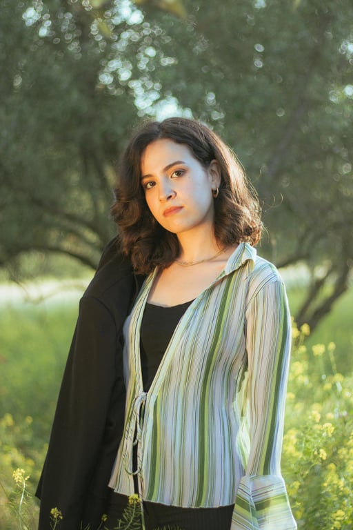 a portrait of a person stylized in a Native American art style focusing on pattern, symbolism, flat design, and cultural restraint rather than realism