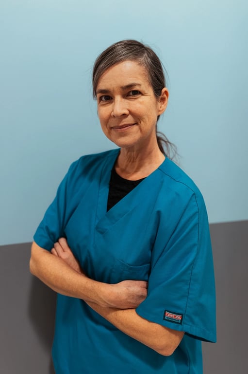 a portrait of a woman, cinematic teal and orange color grading, dramatic side lighting, shallow depth of field, neutral background.