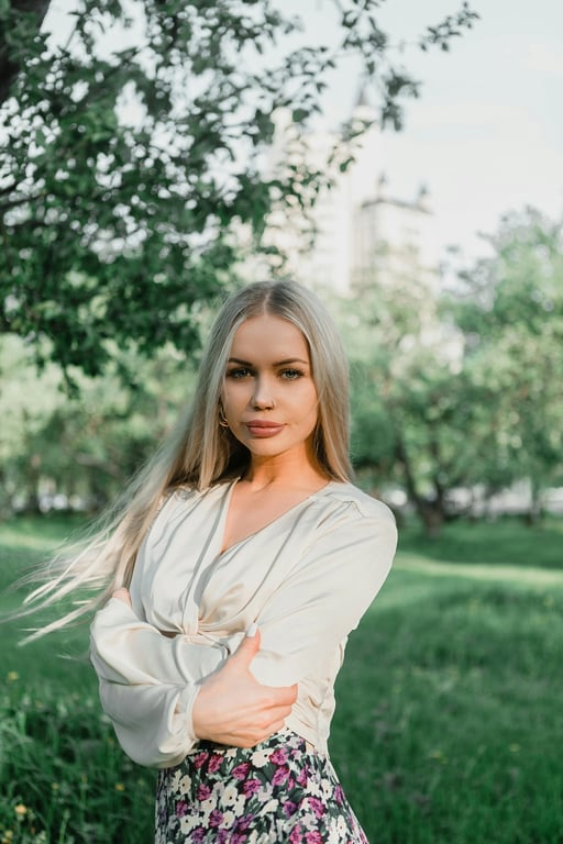 a portrait of a person enhanced with golden hour lighting, featuring low-angle sunlight from the side, warm amber highlights on skin, soft orange glow on hair edges, and balanced natural shadows