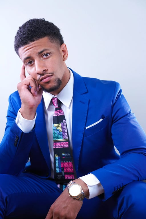 A warm vintage-style headshot of a man, sepia-inspired midtones, preserved detail in shadows, film-like color palette, timeless portrait feel.