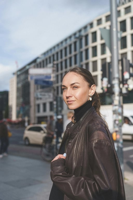 a portrait of a person styled in a minimalist fashion look with sharp tailoring, balanced proportions, smooth texture, understated details, composed standing pose, modern ambient lighting