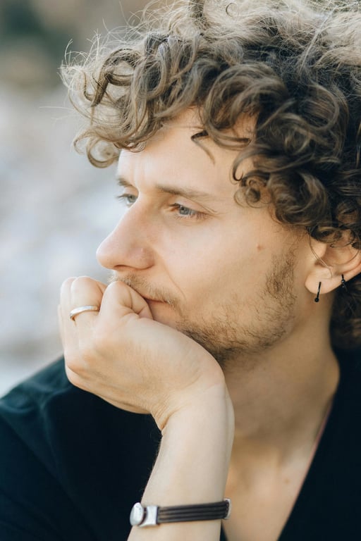 a portrait of a person styled with clean natural black hair and subtle reflective detail