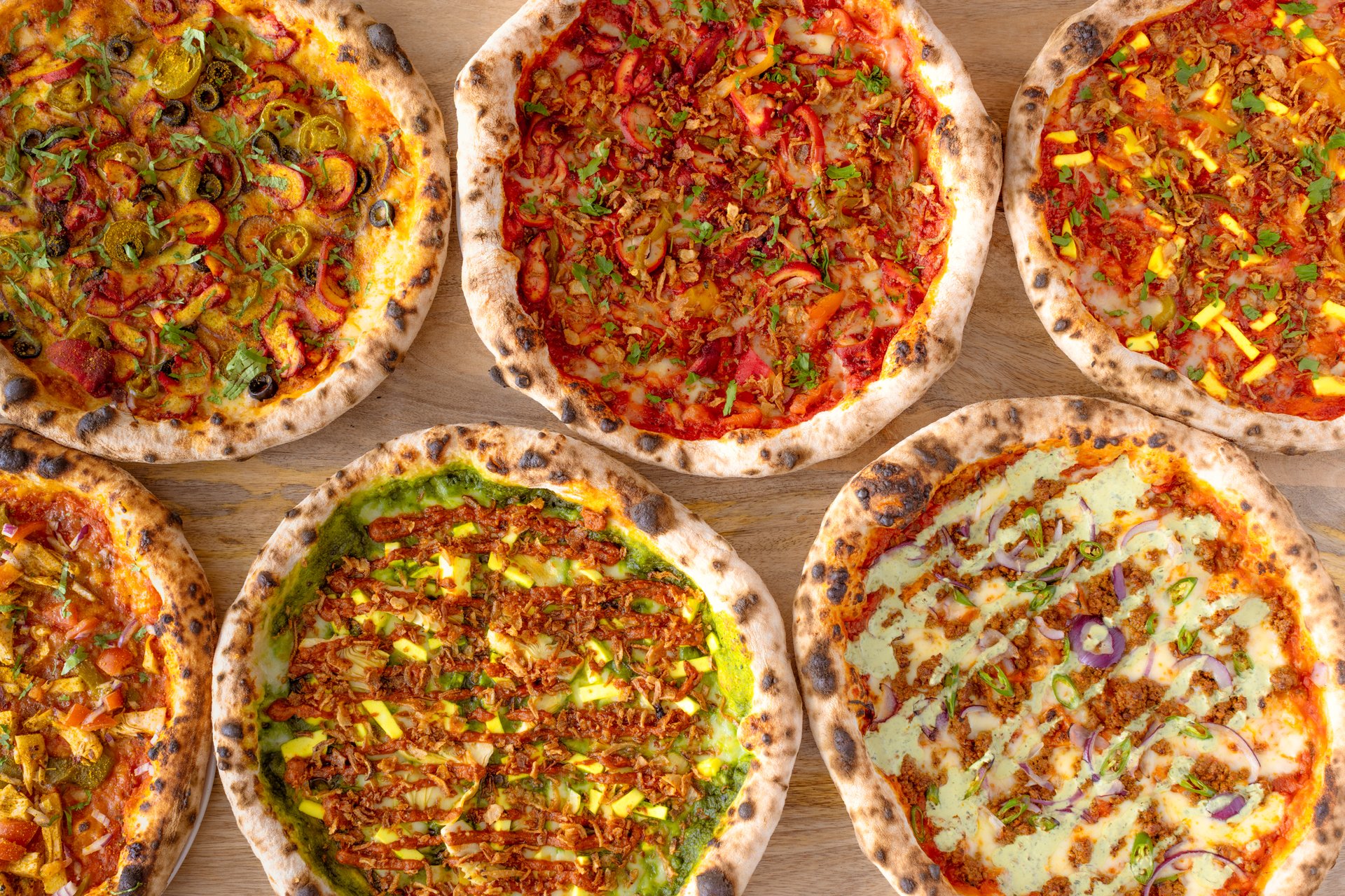 Image of 6 pizzas