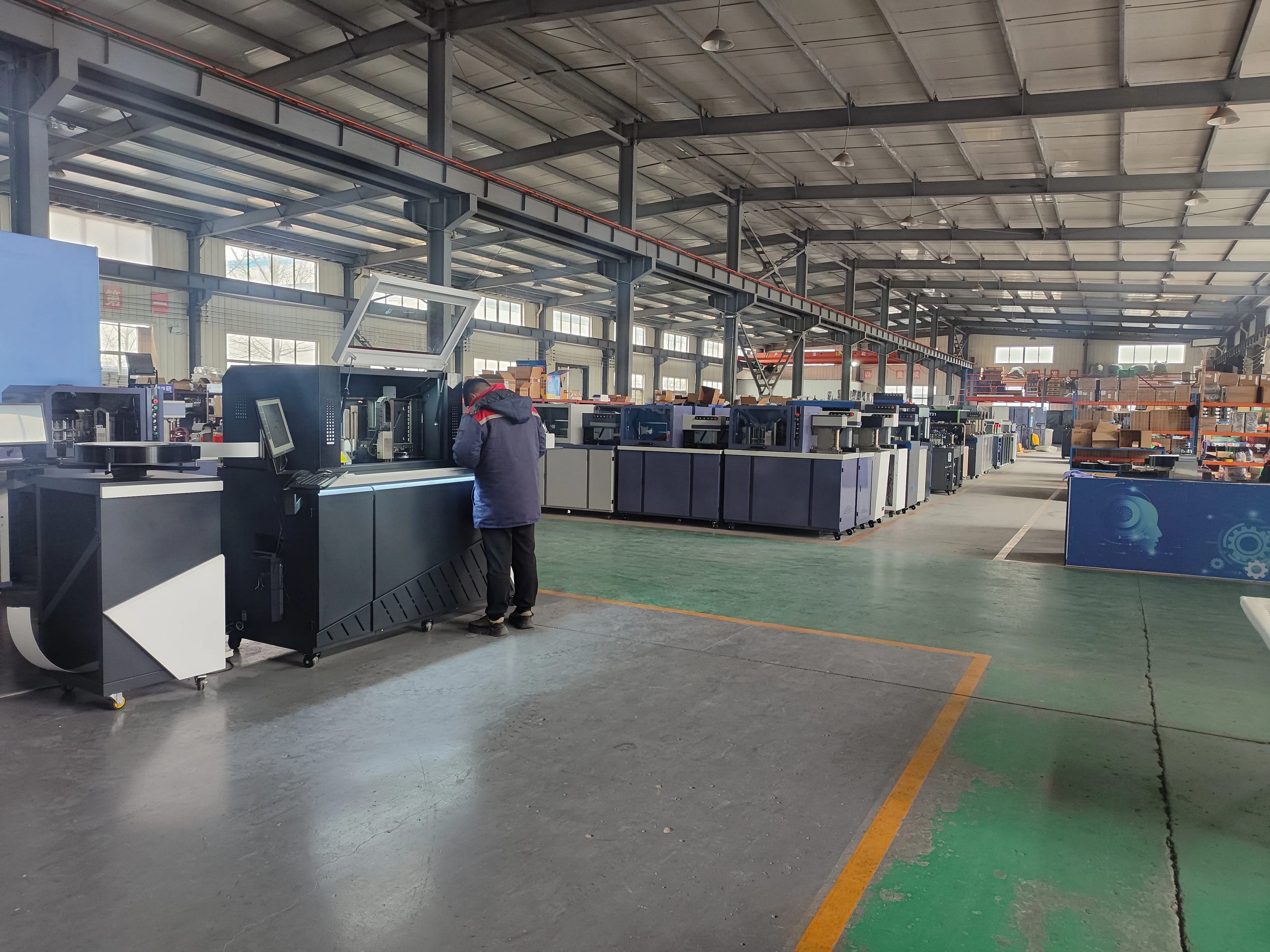 SENQ CNC technicians and channel letter bending machines on the Weifang factory floor