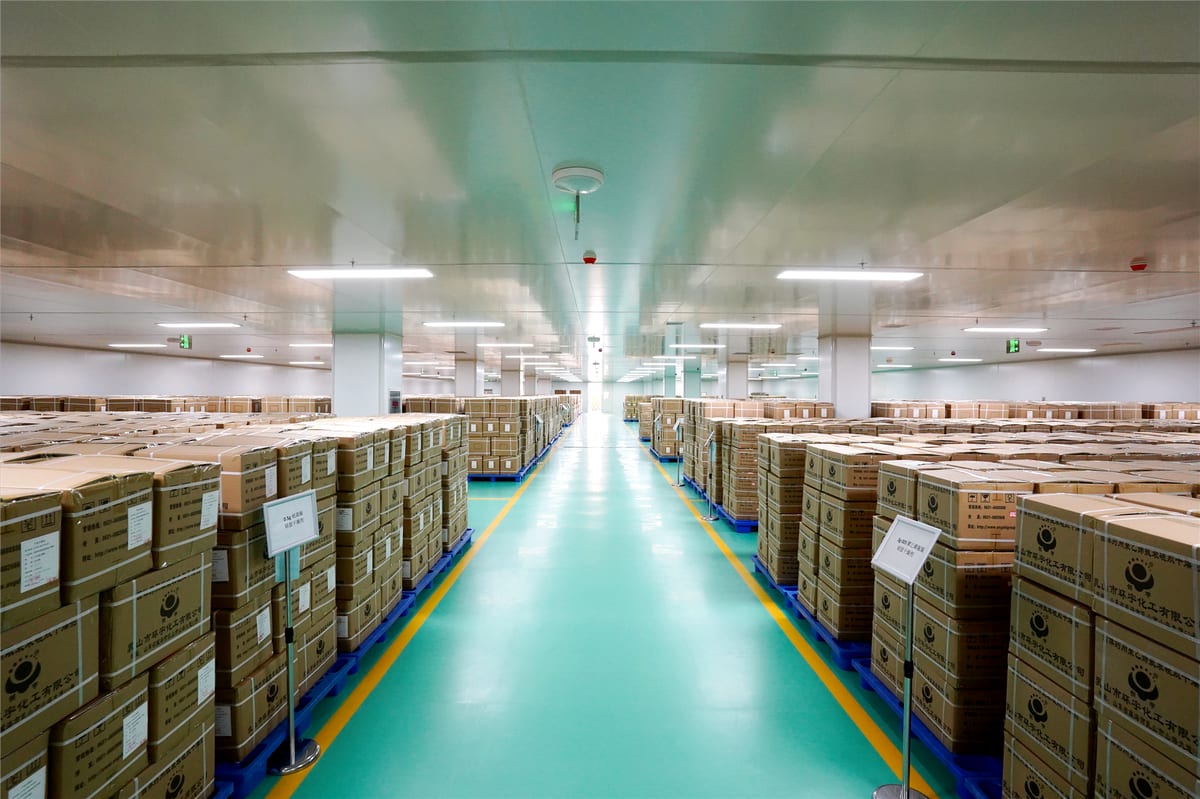 Finished cartons staged in a clean factory warehouse