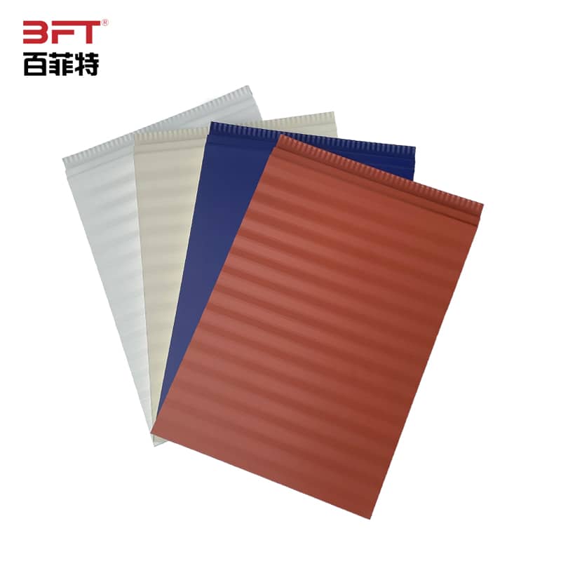 Grey corrugated metal siding surface