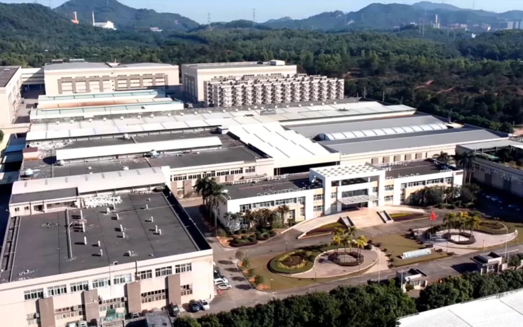 Aerial view of the Meitu production halls and loading bays with solar-panelled roofs