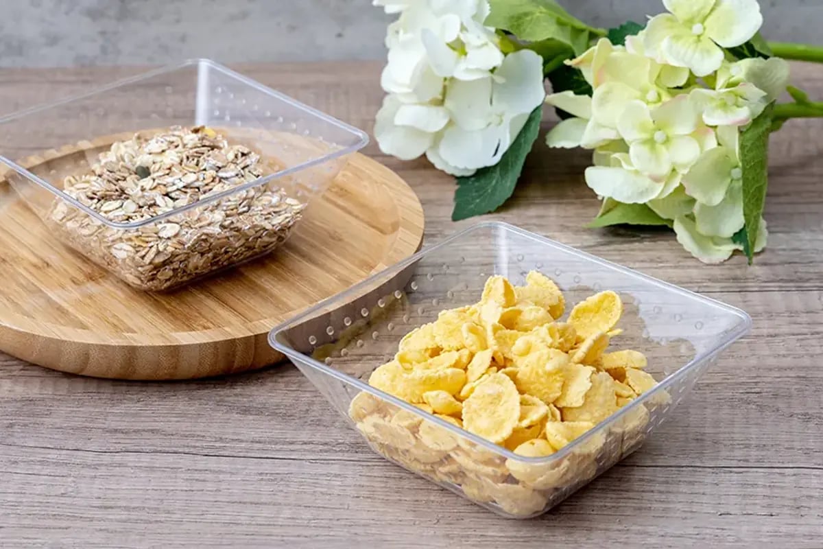 Clear food containers shown with different dry-food portions