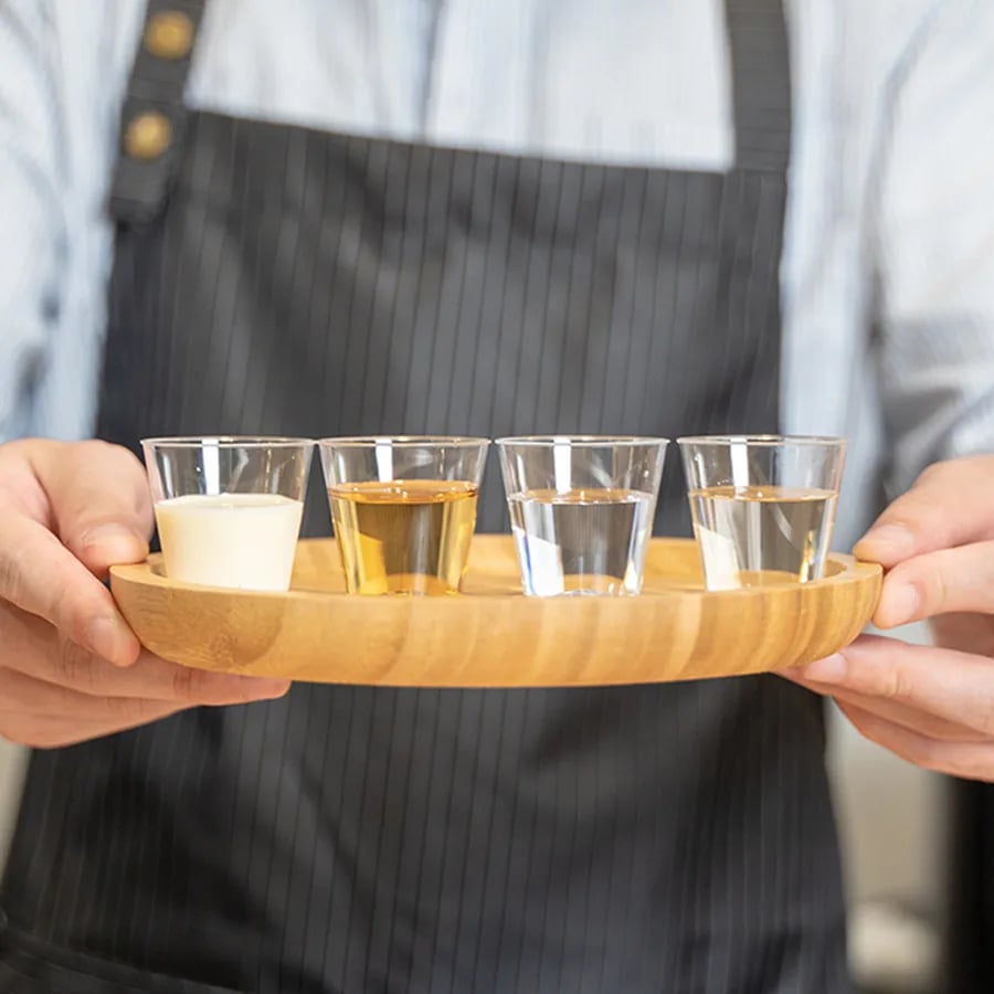 Clear portion cups carried on a serving tray