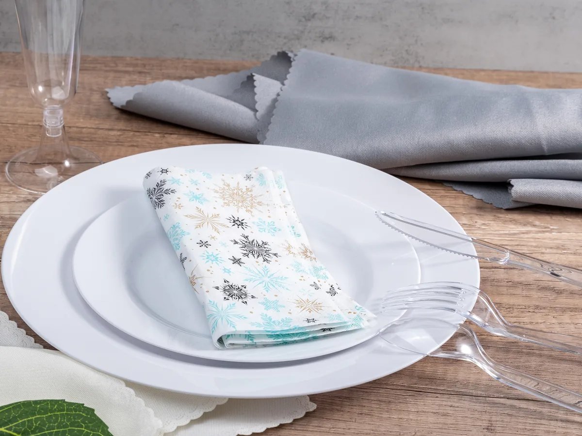 White disposable plates arranged for institutional dining service