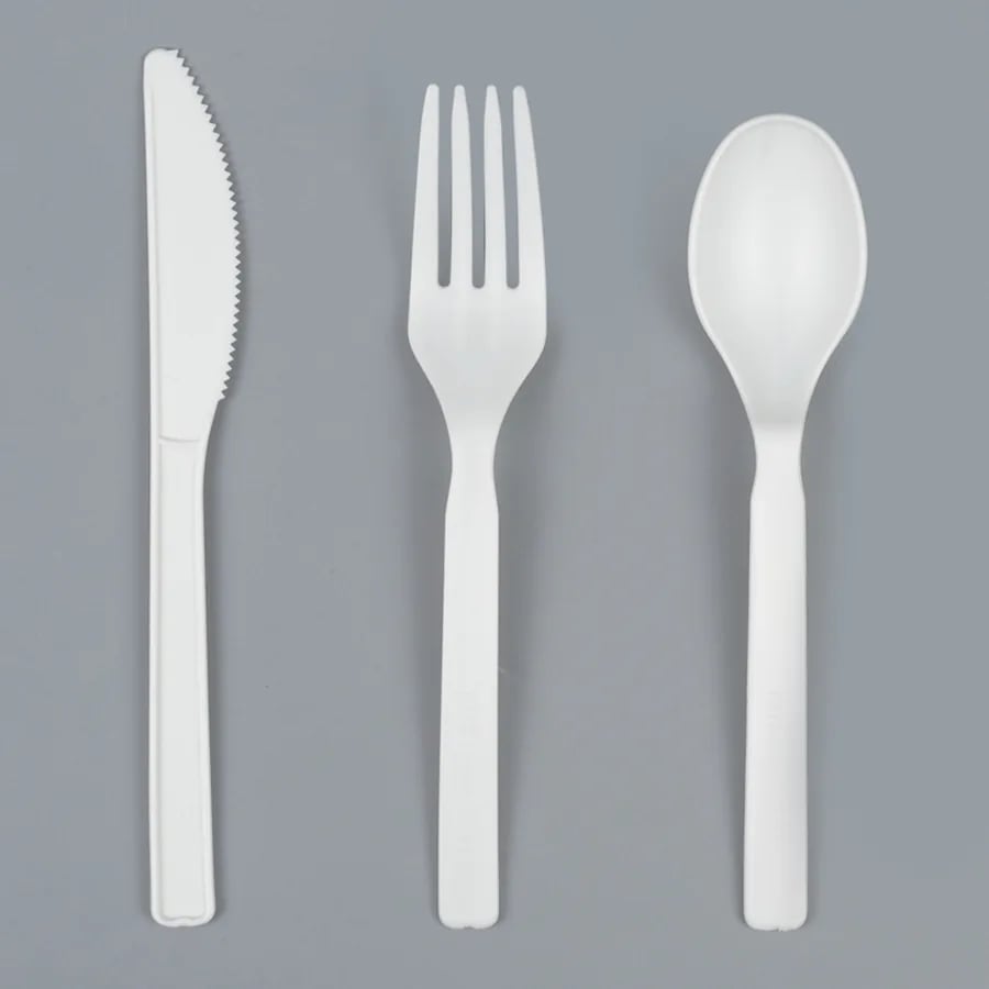 White CPLA knife, fork, and spoon shown in a clean studio presentation